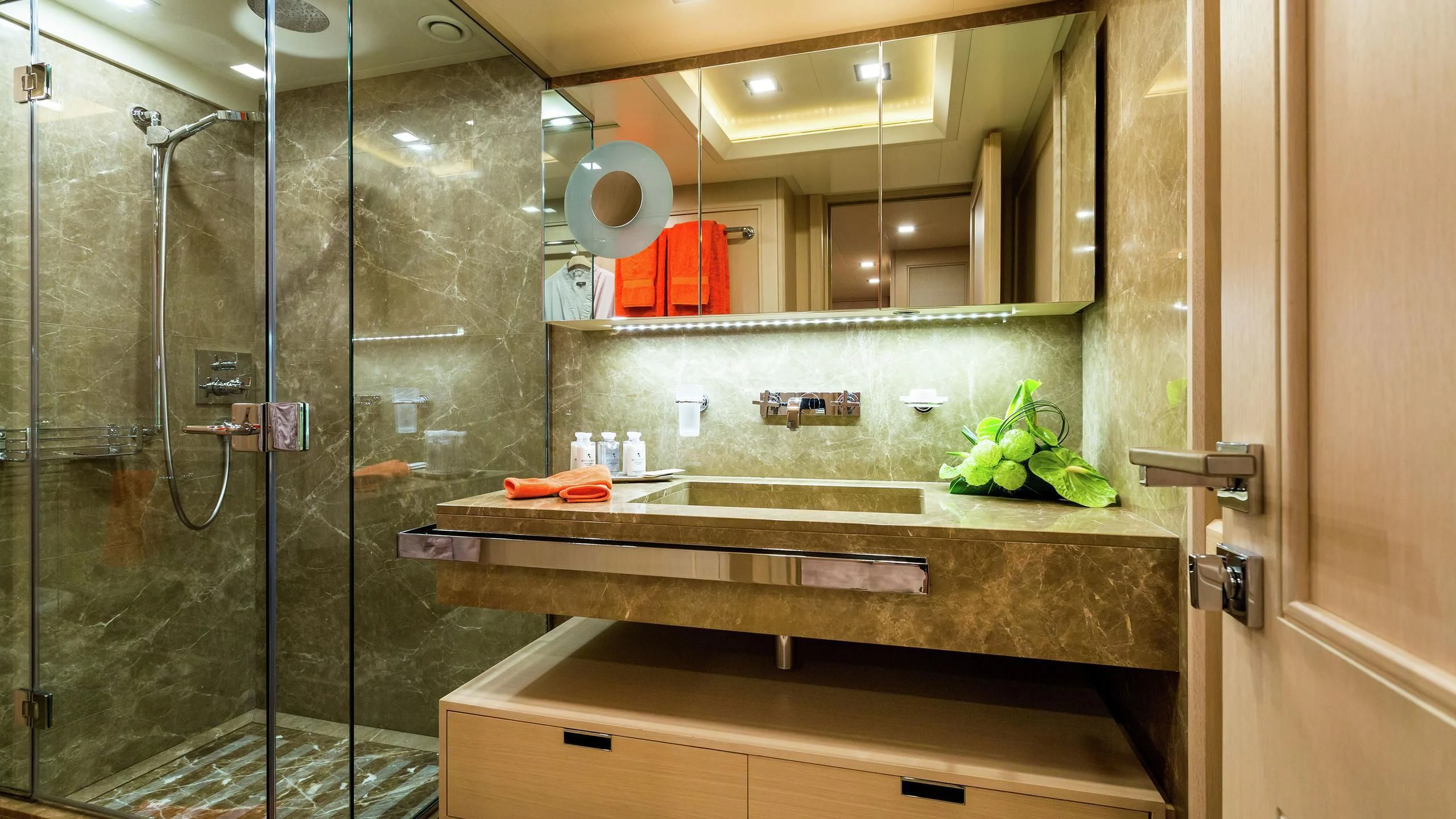 a bathroom with a glass shower aboard PHOTON Yacht for Sale
