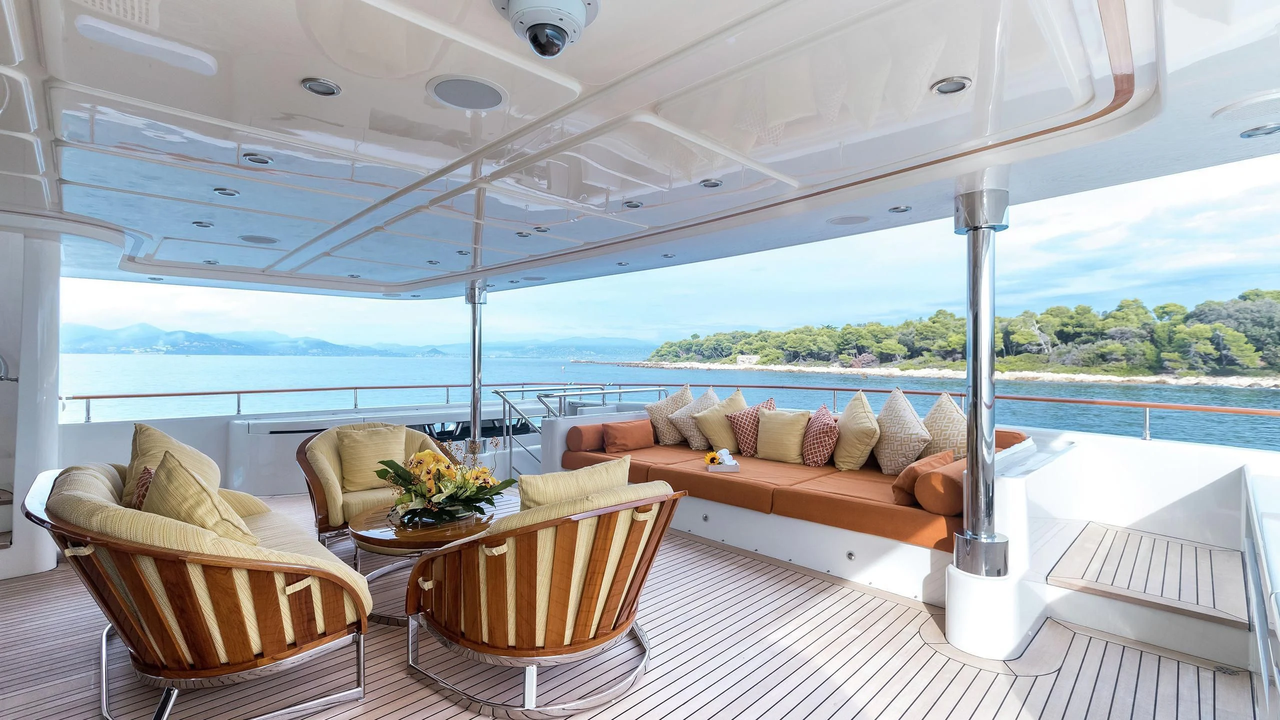 a room with a table and chairs aboard PHOTON Yacht for Sale