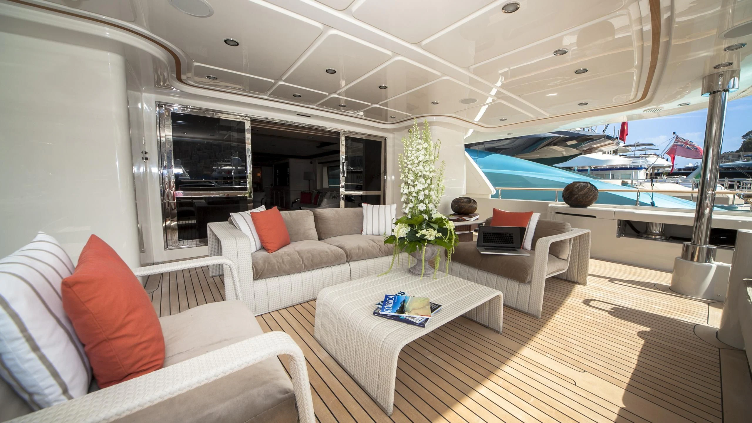 a living room with a large swimming pool aboard PHOTON Yacht for Sale