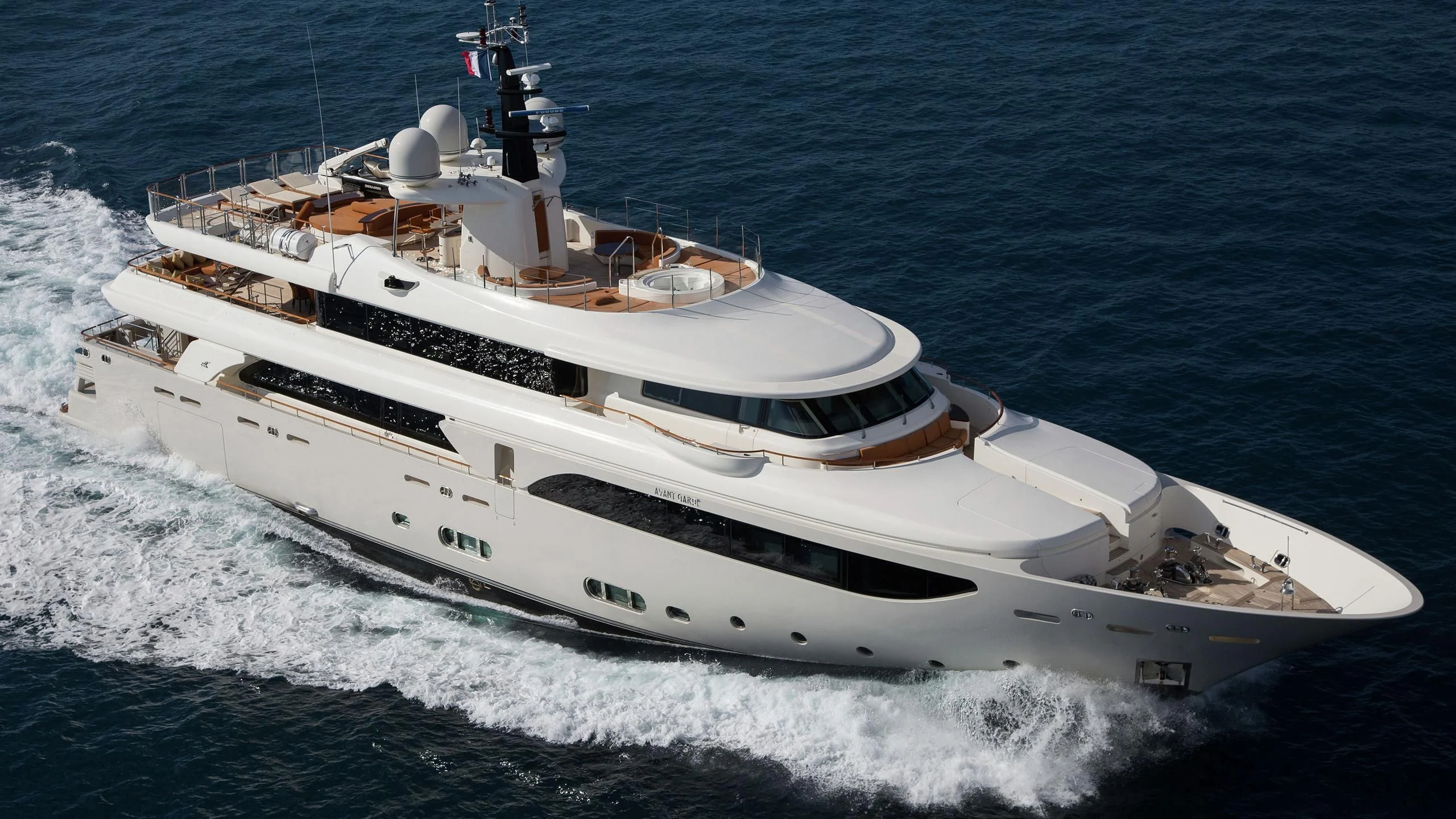 a white yacht on the water aboard PHOTON Yacht for Sale