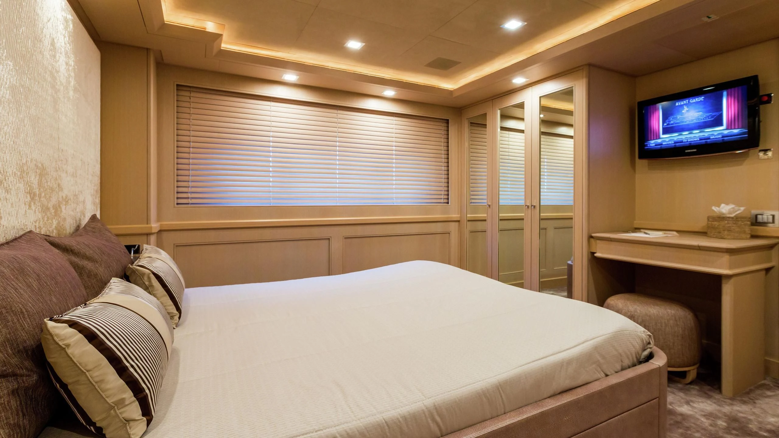 a bed in a room aboard PHOTON Yacht for Sale