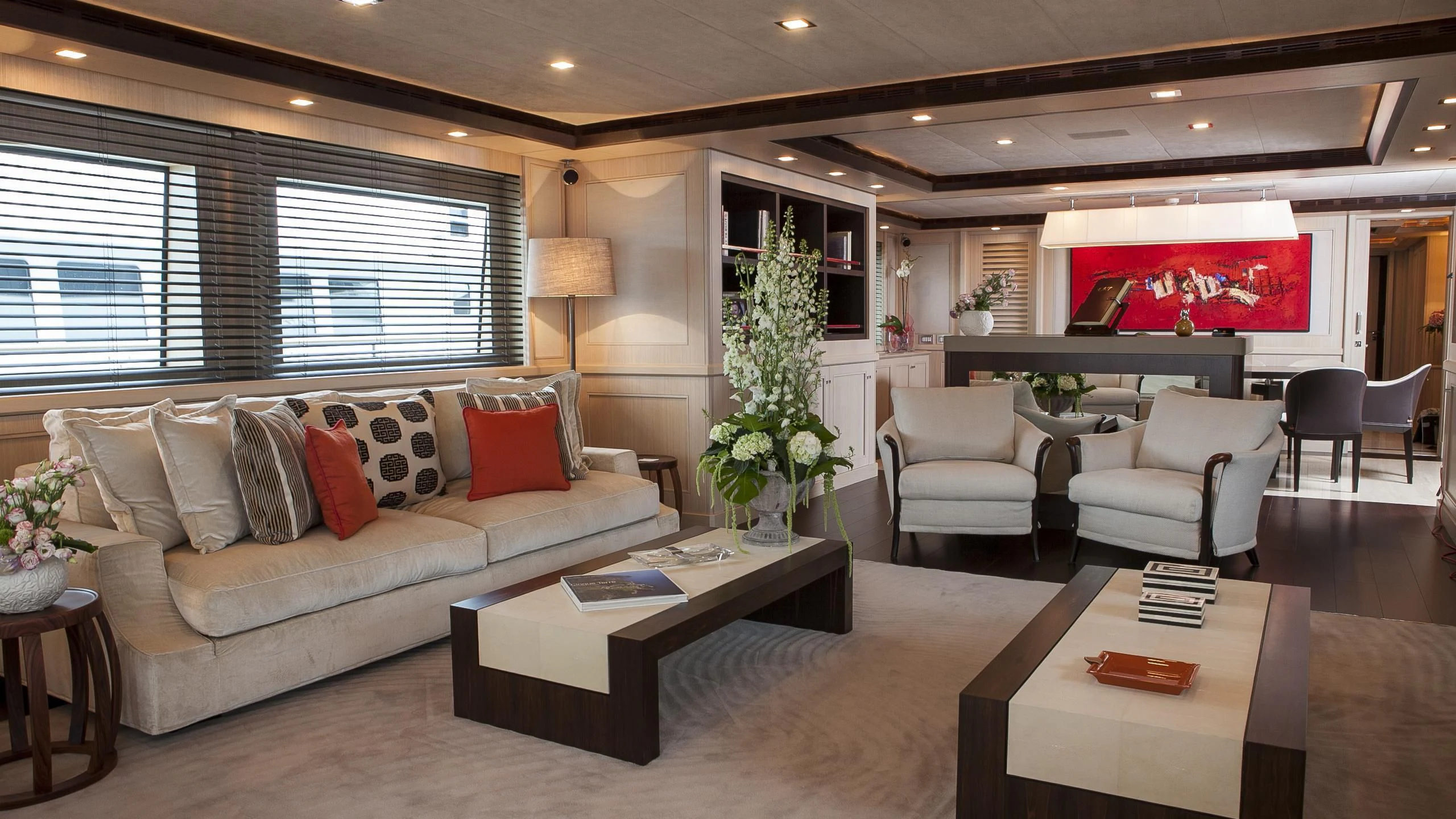 a living room with a couch and a coffee table aboard PHOTON Yacht for Sale