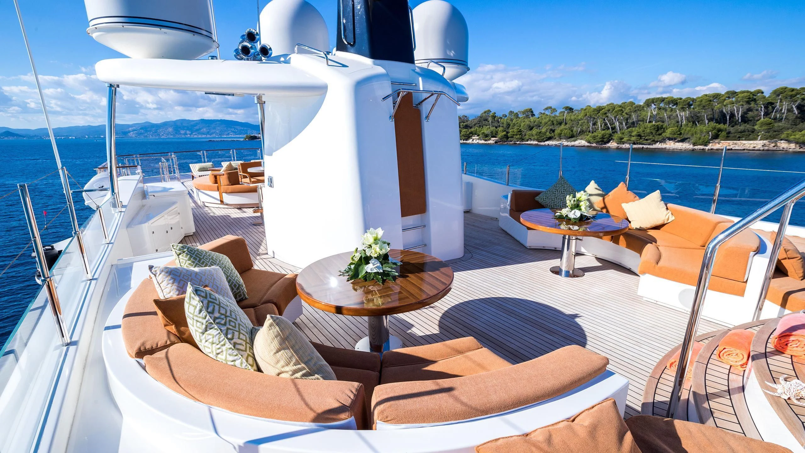 a room with a table and chairs on it aboard PHOTON Yacht for Sale