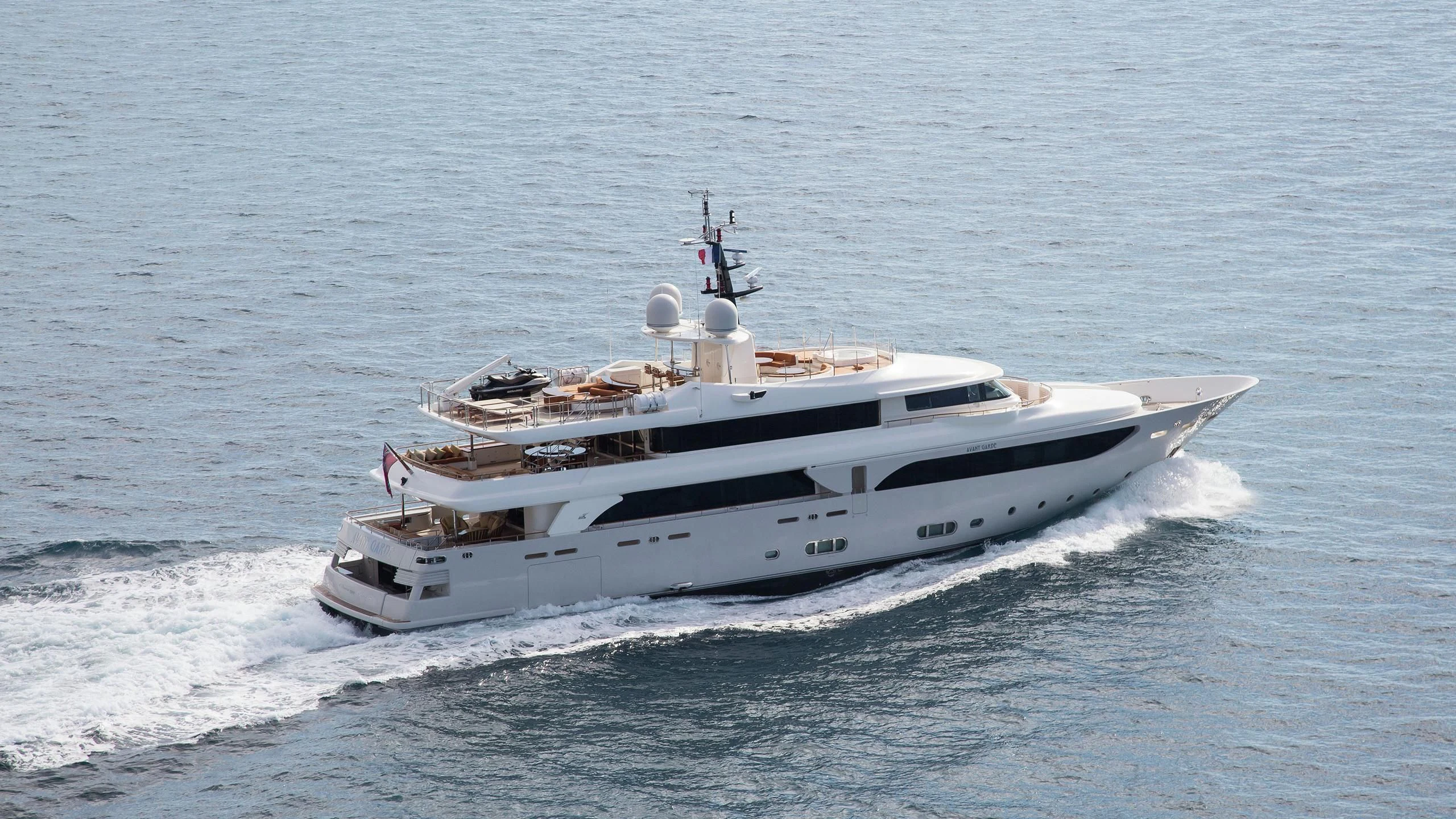 a white yacht on the water aboard PHOTON Yacht for Sale