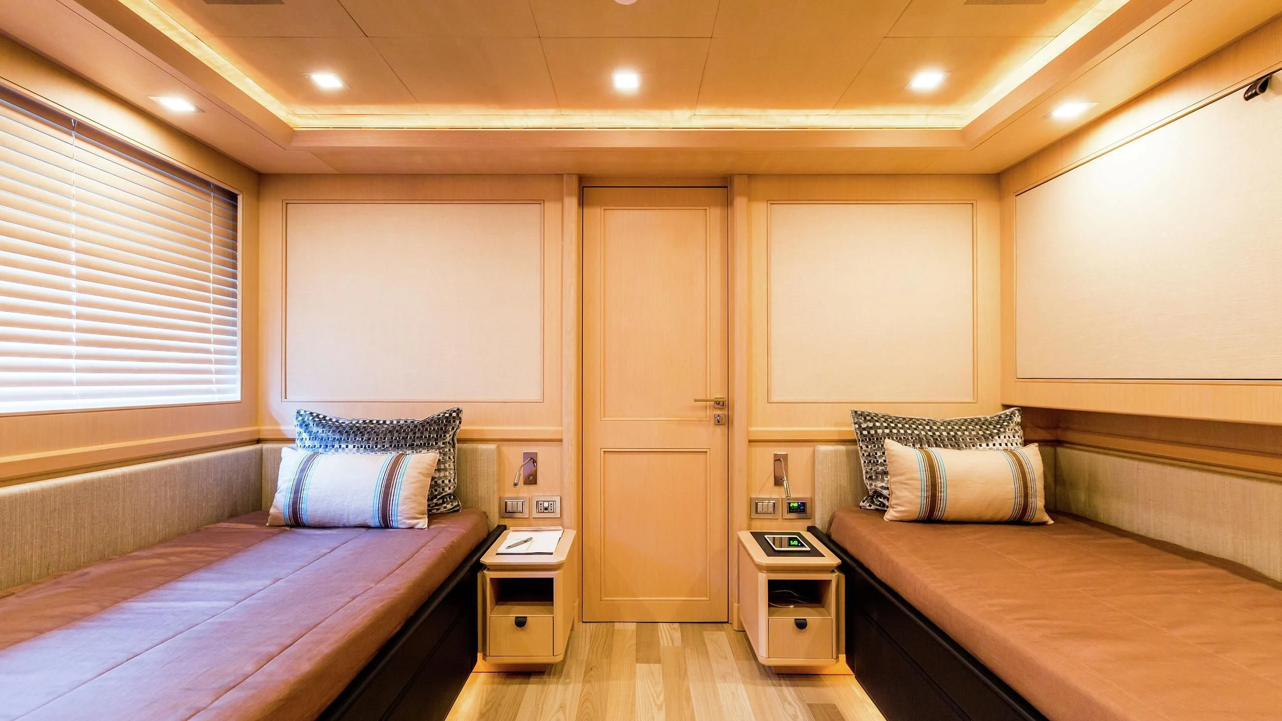 a room with two beds aboard PHOTON Yacht for Sale