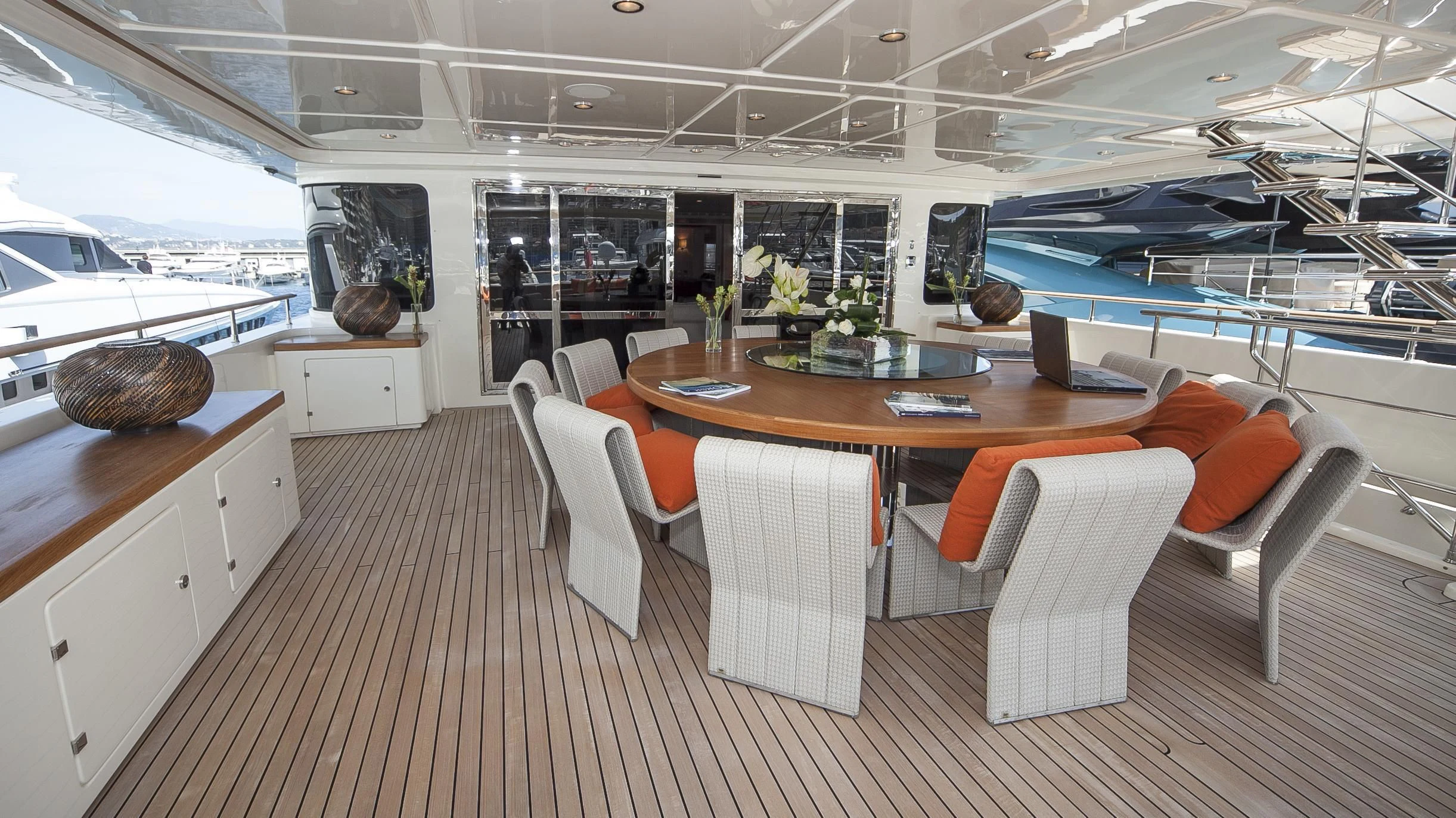 a room with a table chairs and a large window aboard PHOTON Yacht for Sale