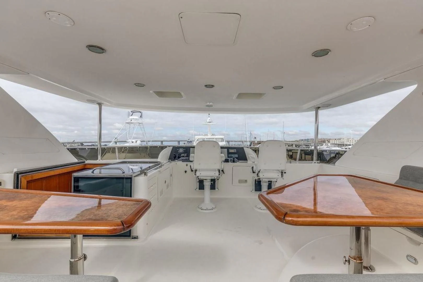 a room with tables and chairs aboard LADY GIGI Yacht for Sale
