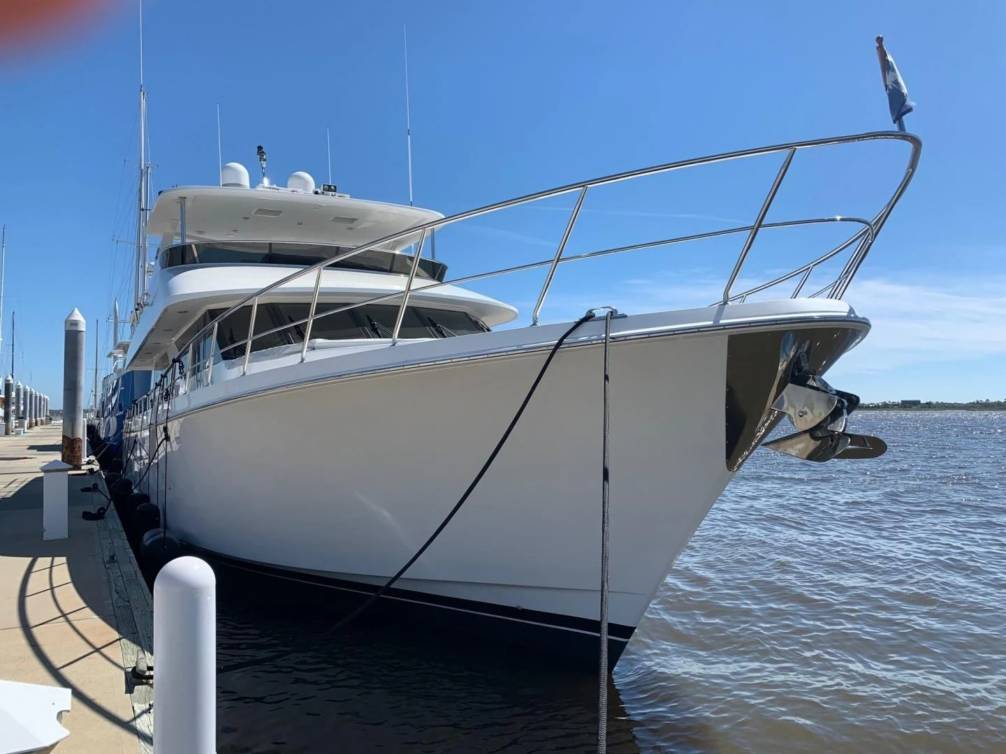 a white boat on a dock aboard LADY GIGI Yacht for Sale