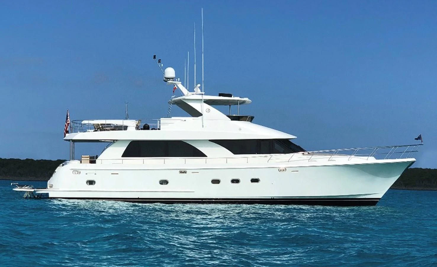 a white yacht on the water aboard LADY GIGI Yacht for Sale