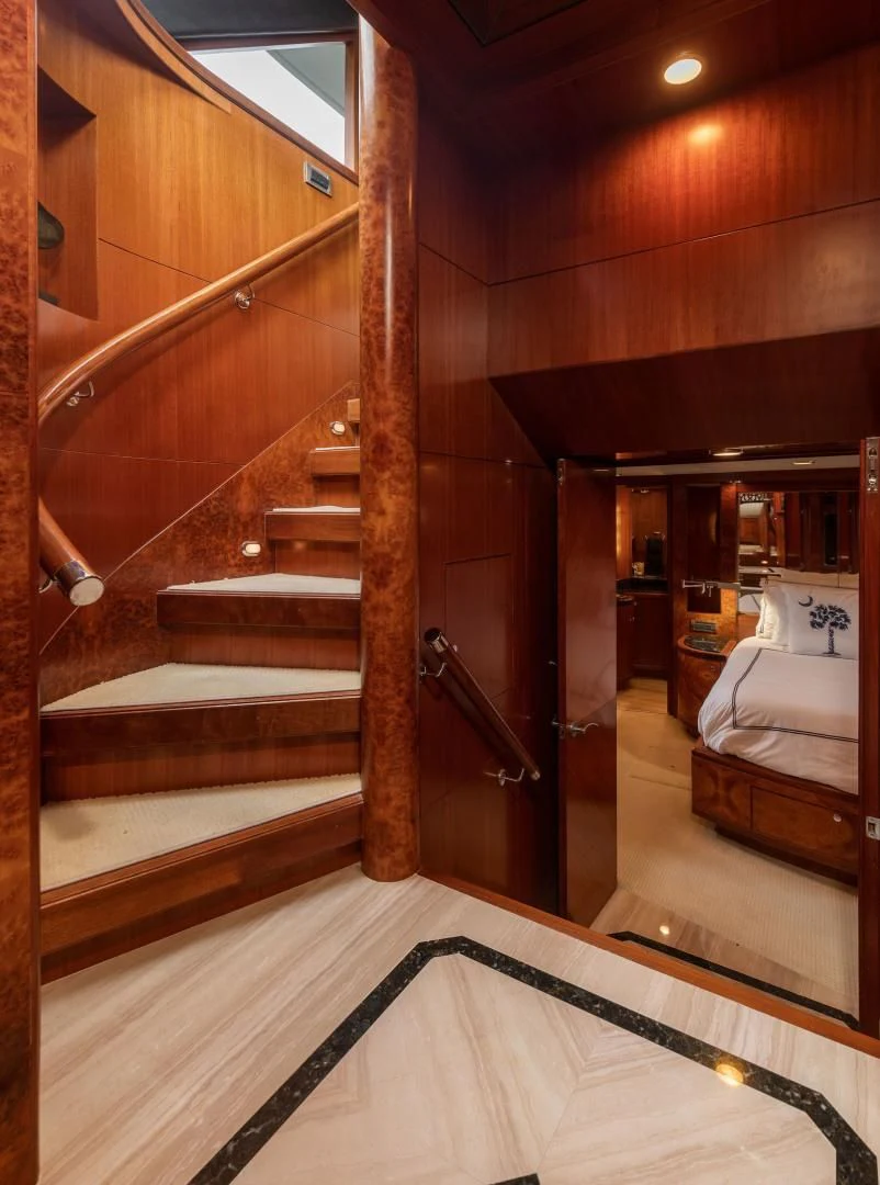 a bathroom with a wood staircase aboard LADY GIGI Yacht for Sale