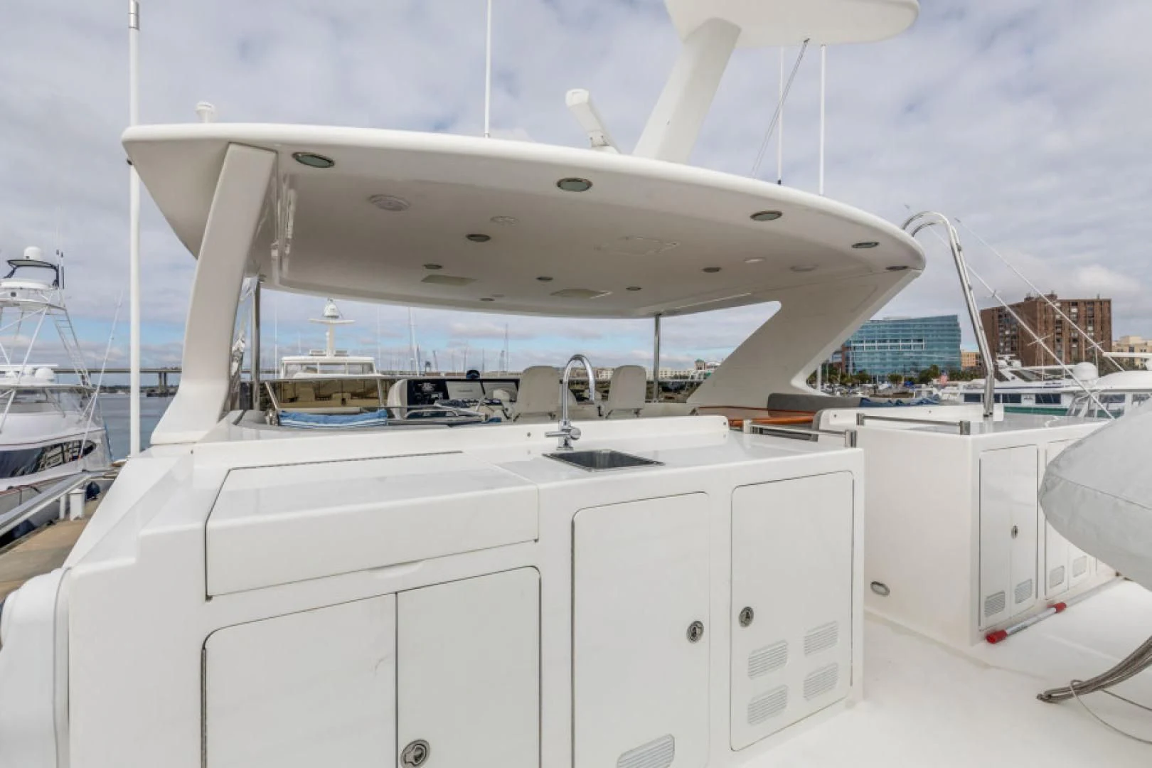 a white boat with a large white boat on it aboard LADY GIGI Yacht for Sale