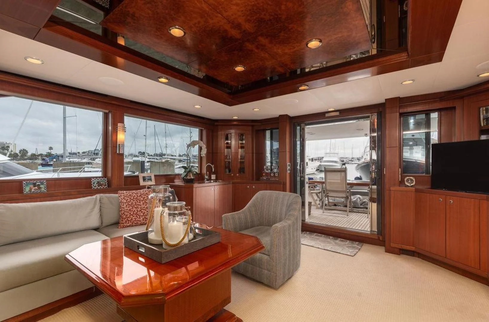 a living room with a table and chairs aboard LADY GIGI Yacht for Sale