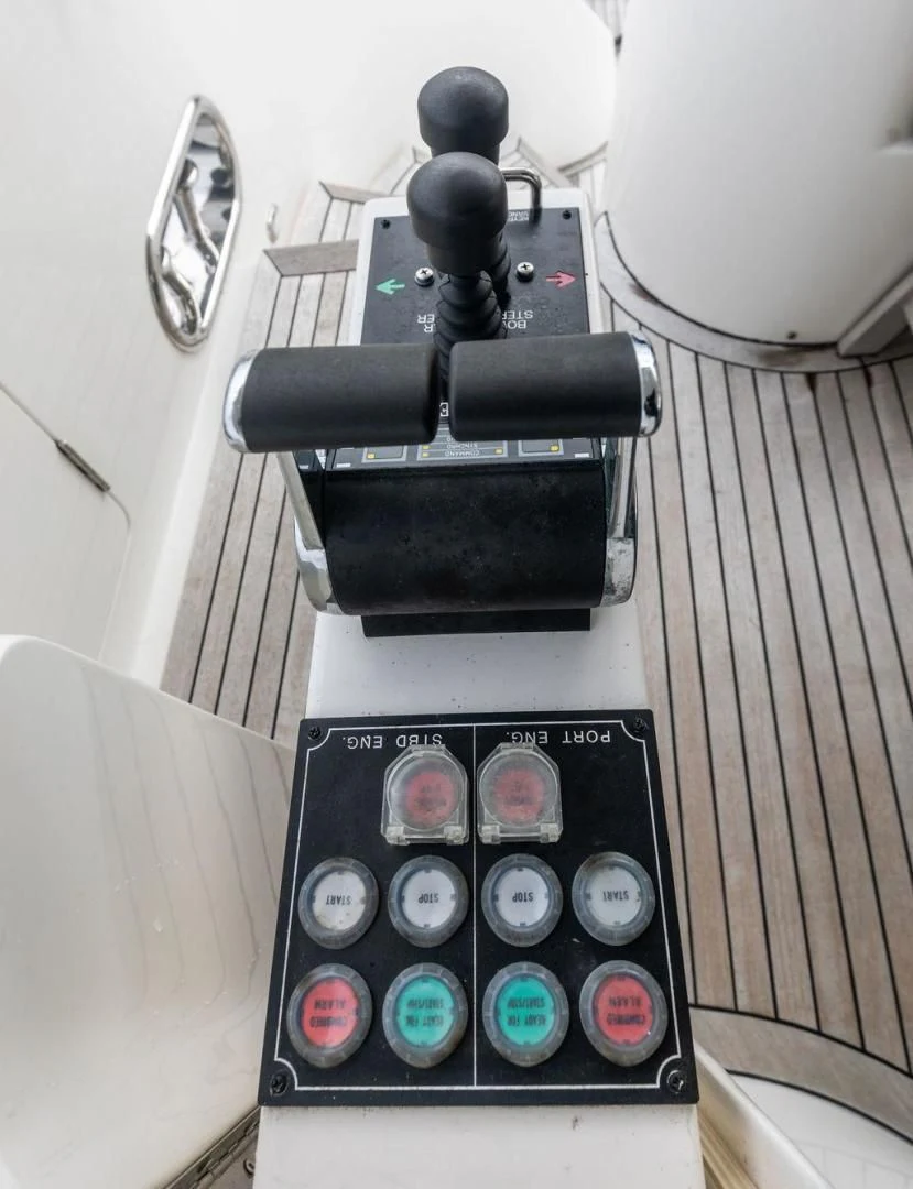 a black telephone on a white surface aboard LADY GIGI Yacht for Sale