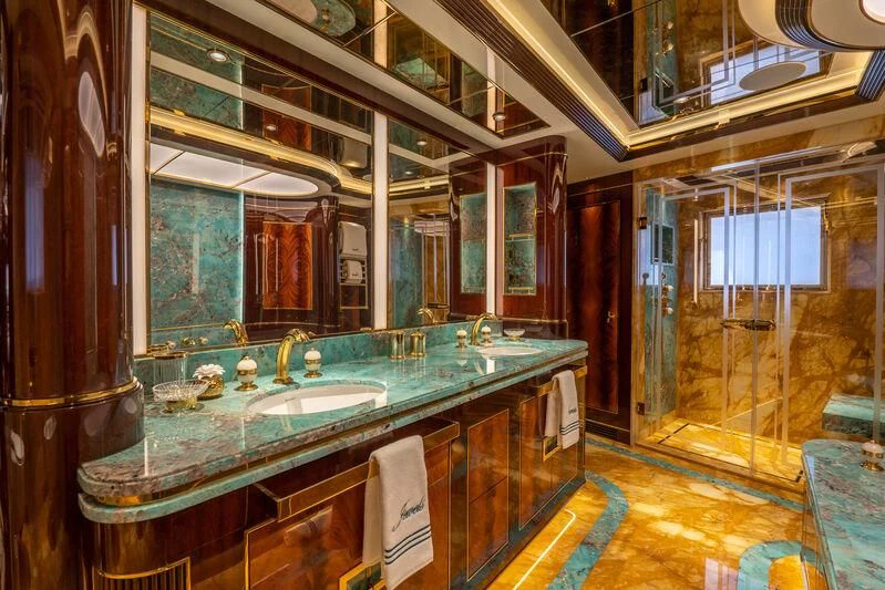 a bathroom with a large mirror aboard JEWELS Yacht for Sale