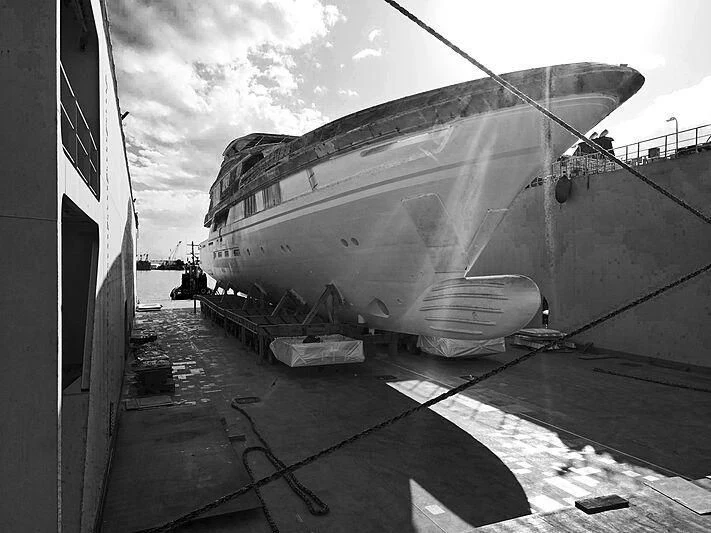 a large ship docked aboard JEWELS Yacht for Sale