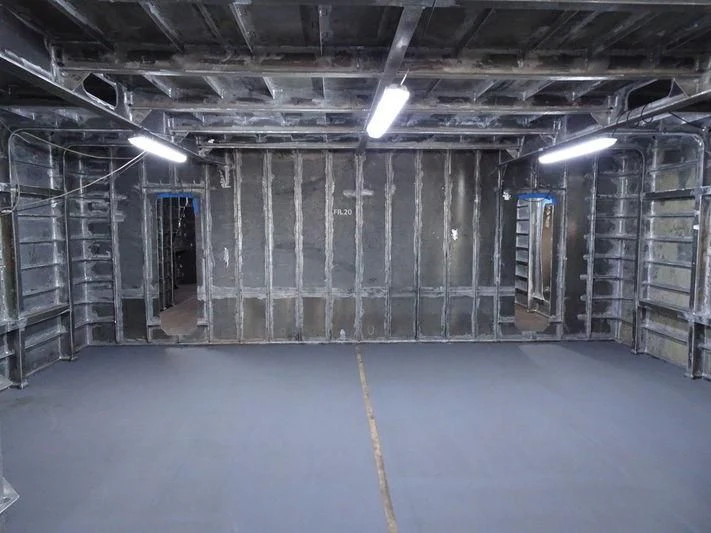 a room with a lot of metal walls and a few doors aboard JEWELS Yacht for Sale