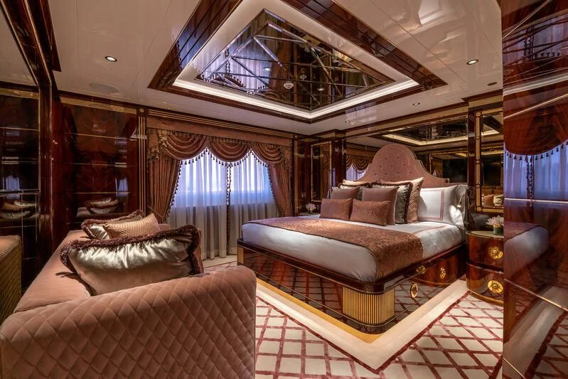 a large living room with a large bed aboard JEWELS Yacht for Sale