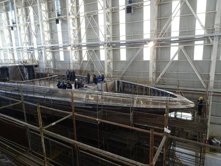 a group of people in a large building aboard JEWELS Yacht for Sale