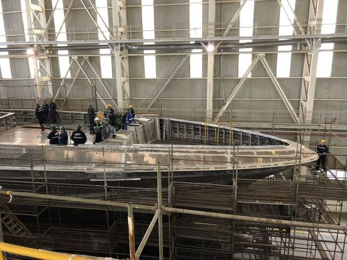 a group of people in a factory aboard JEWELS Yacht for Sale