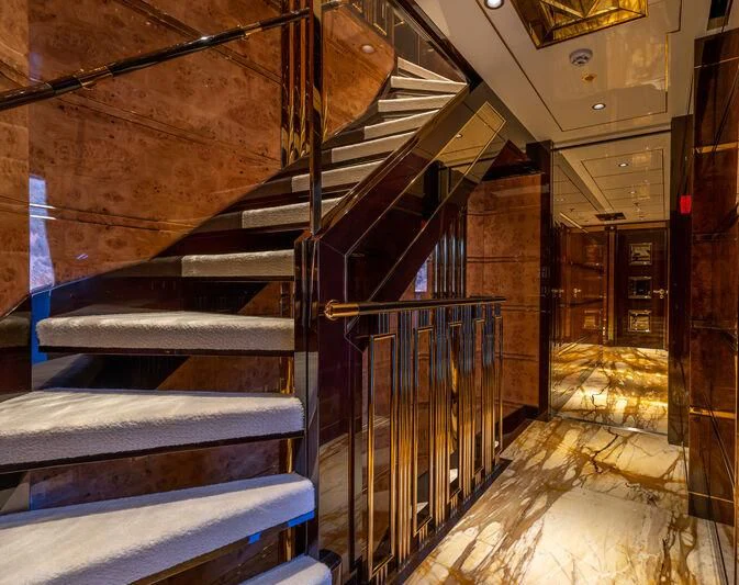 a staircase in a building aboard JEWELS Yacht for Sale