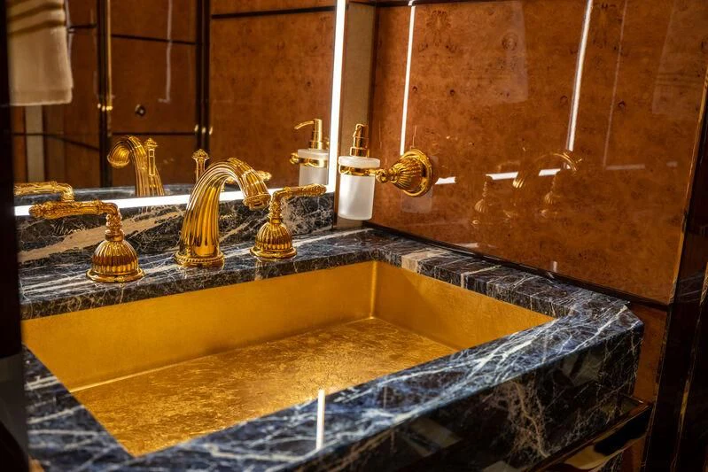 a bathroom with a marble counter top aboard JEWELS Yacht for Sale
