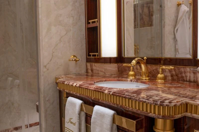 a bathroom with a sink and a mirror aboard JEWELS Yacht for Sale