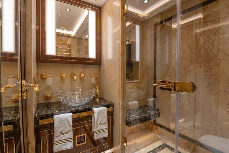 a bathroom with a sink and a mirror aboard JEWELS Yacht for Sale