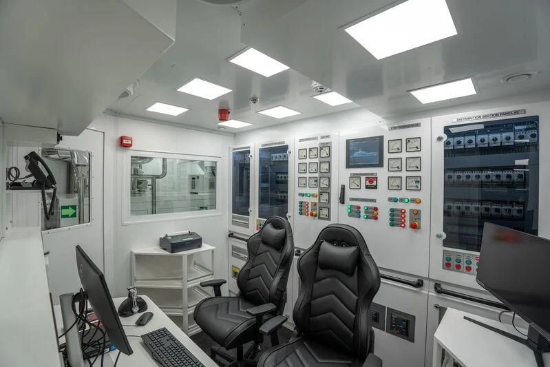an office with computers and chairs aboard JEWELS Yacht for Sale