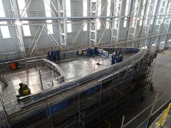 a large warehouse with many people in it aboard JEWELS Yacht for Sale