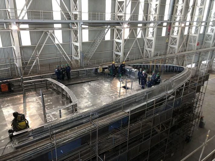 a large building with glass walls aboard JEWELS Yacht for Sale