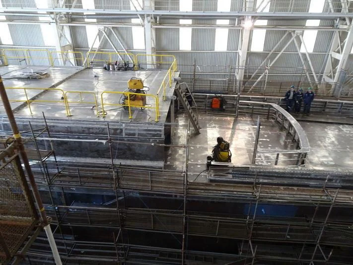 a group of people working in a factory aboard JEWELS Yacht for Sale