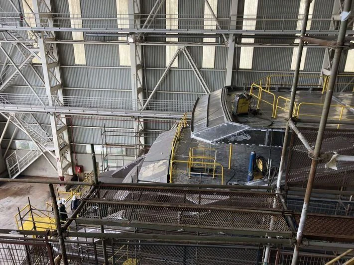 a large warehouse with a few machines aboard JEWELS Yacht for Sale