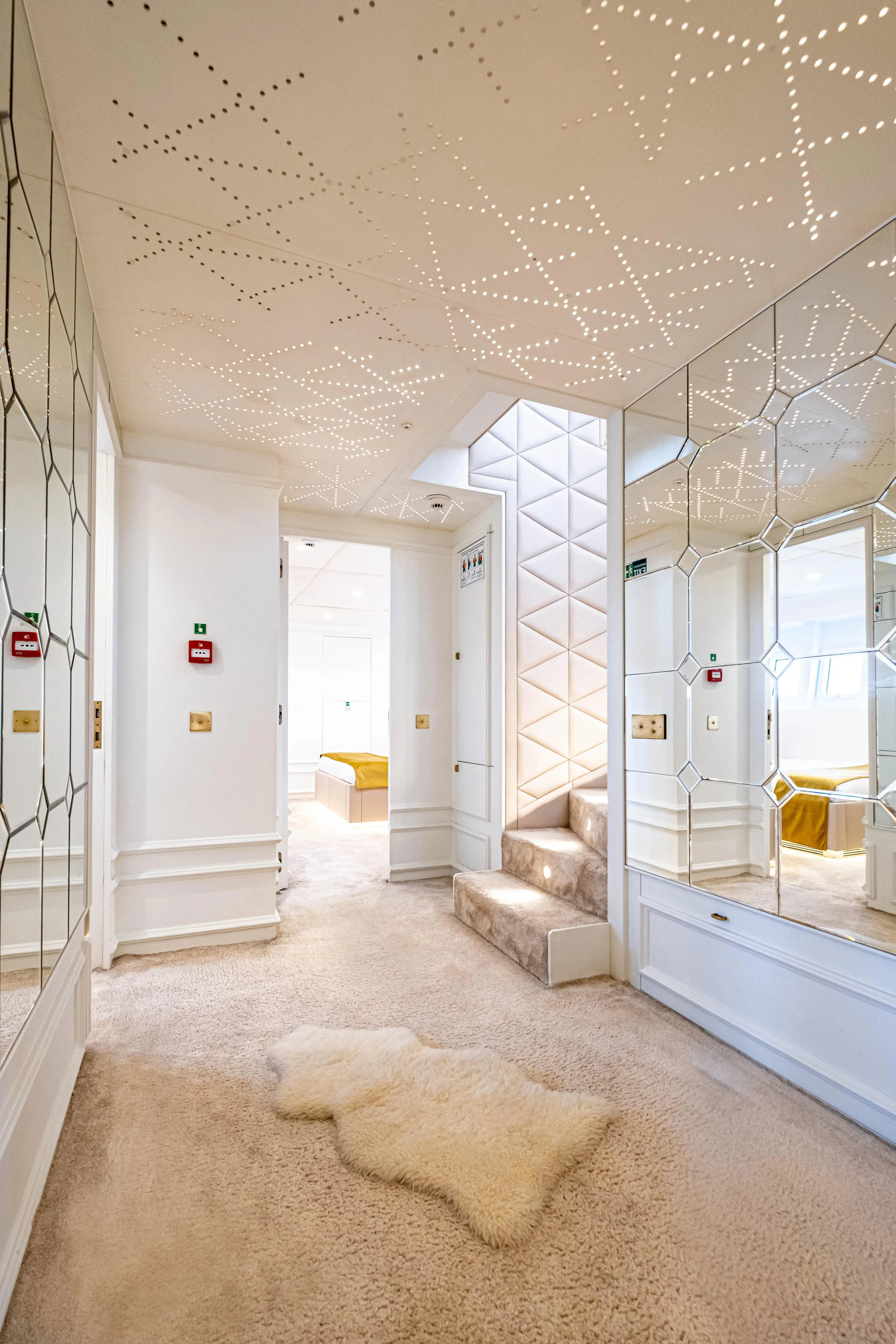 a room with a couch and a rug aboard HARUN Yacht for Charter