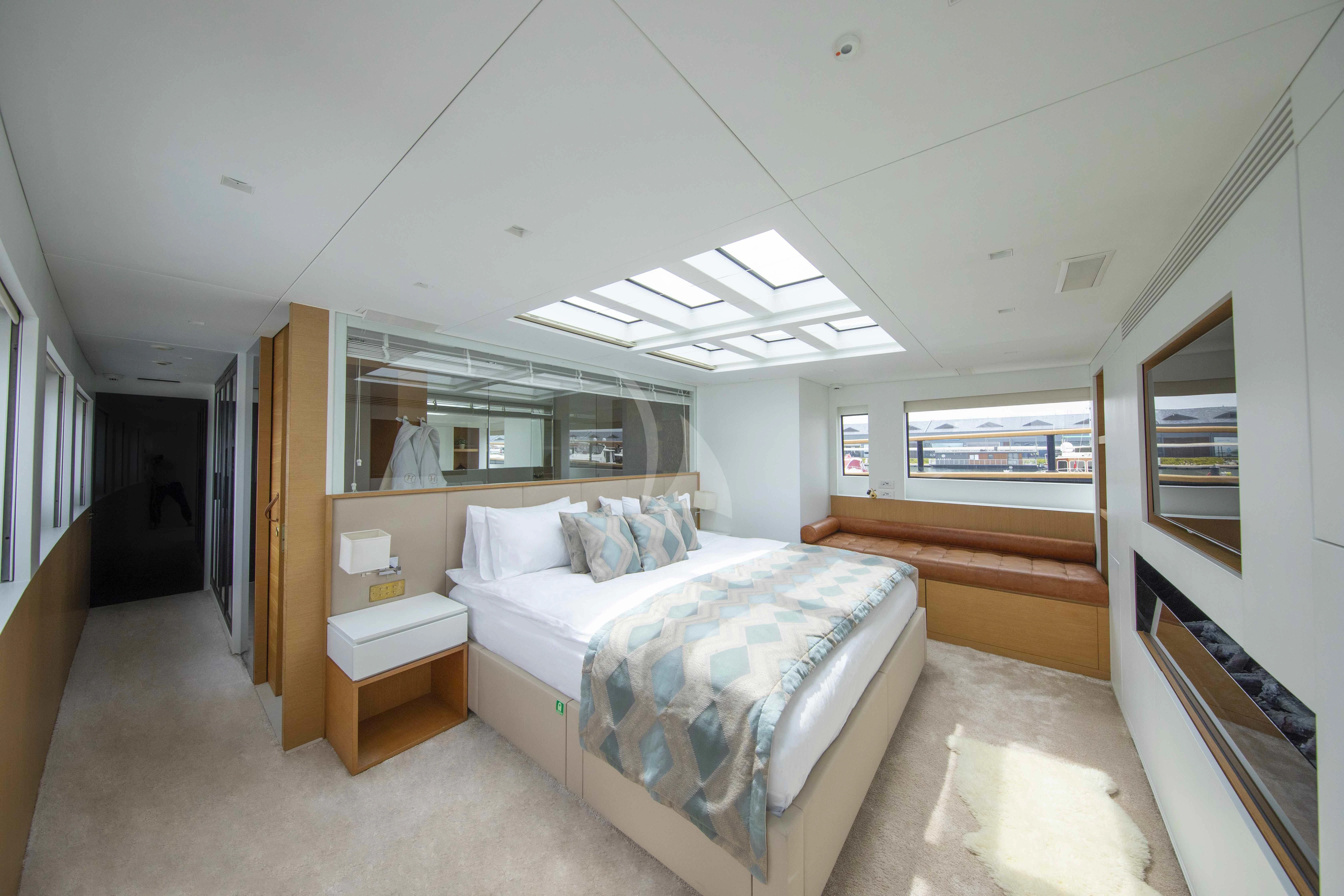 a bedroom with a bed and a desk aboard HARUN Yacht for Charter