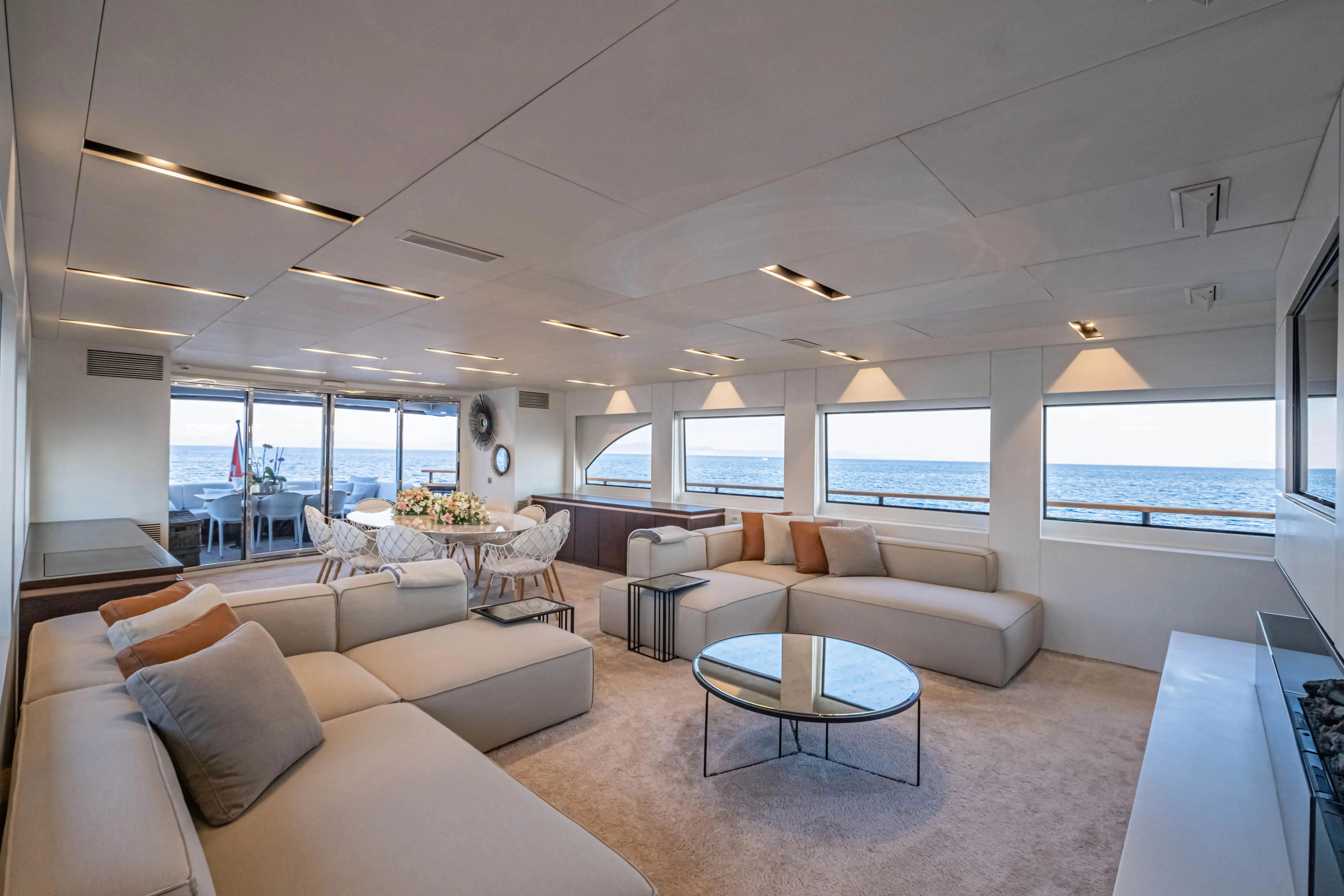 a living room with a large window aboard HARUN Yacht for Charter