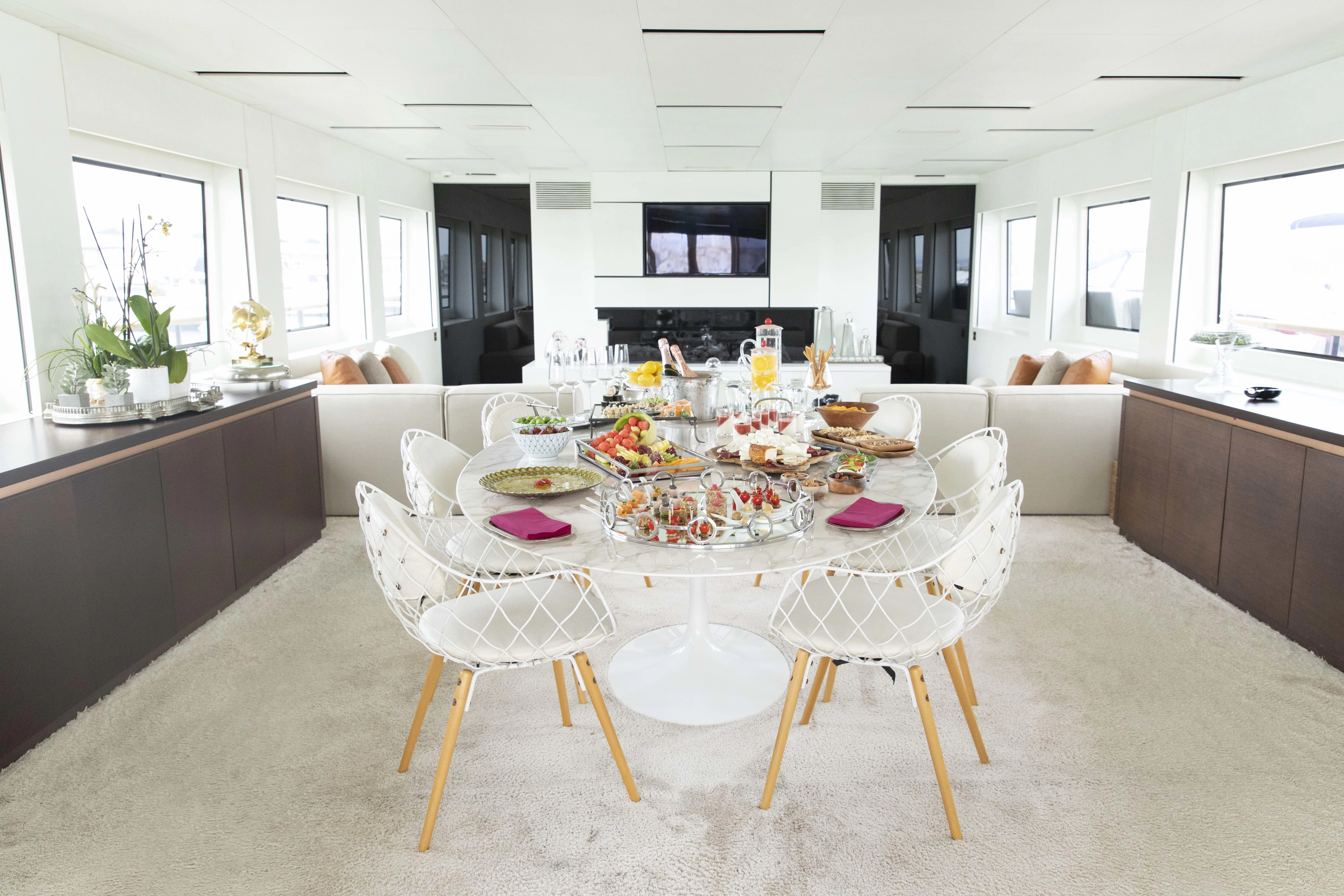 a large dining room with a table and chairs aboard HARUN Yacht for Charter