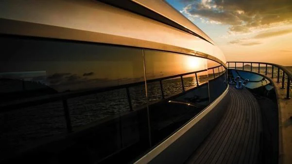 a large pool with a deck and a boat on it aboard HARUN Yacht for Charter