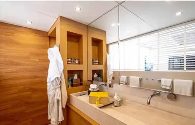 a bathroom with a robe on the wall aboard HARUN Yacht for Charter