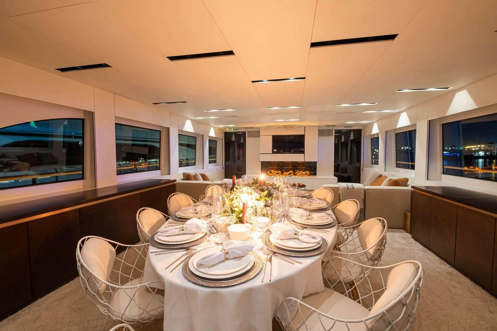 a dining room with a table set for a party aboard HARUN Yacht for Charter