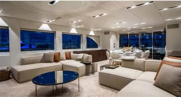 a living room with a large screen aboard HARUN Yacht for Charter