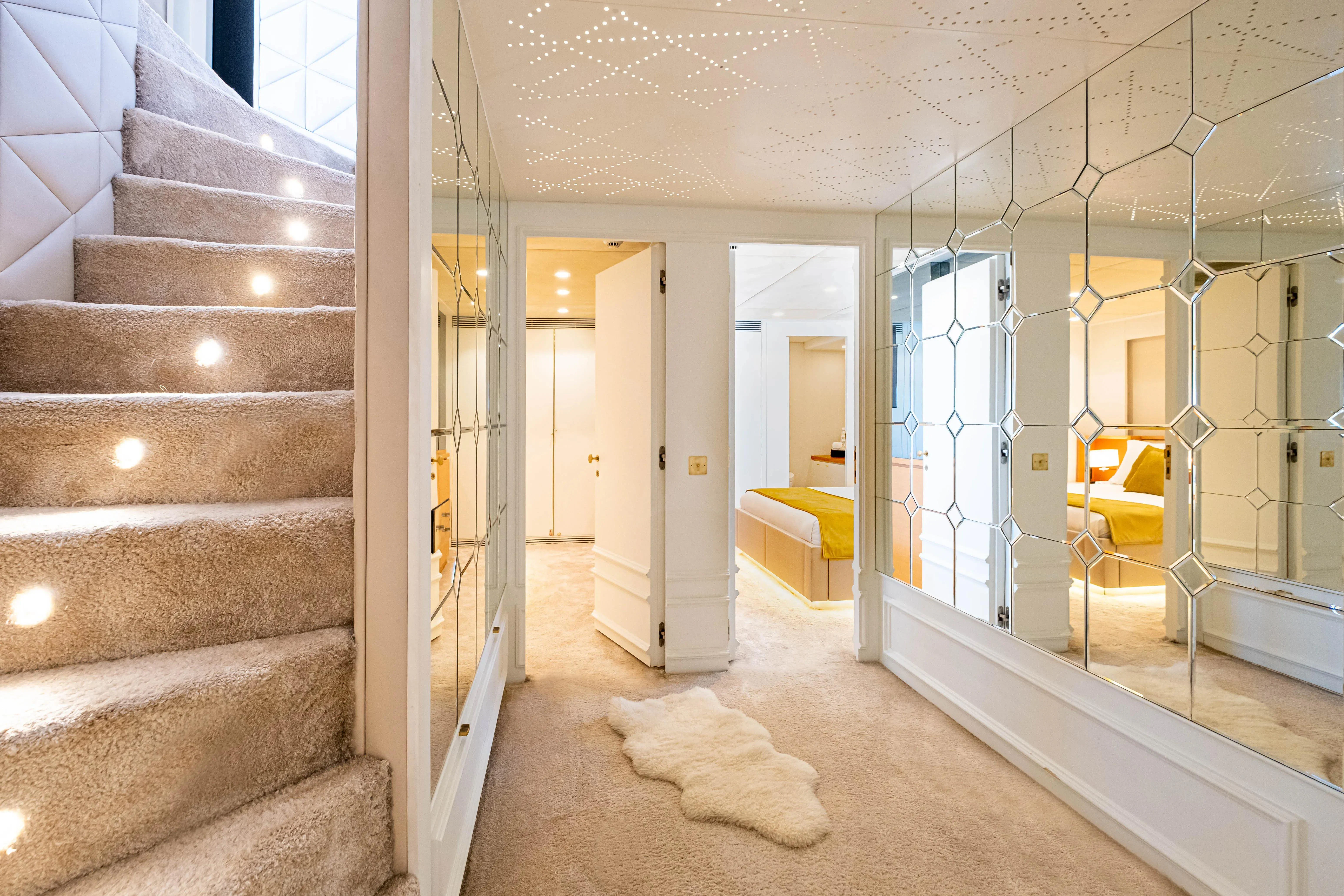 a room with a staircase and a staircase aboard HARUN Yacht for Charter
