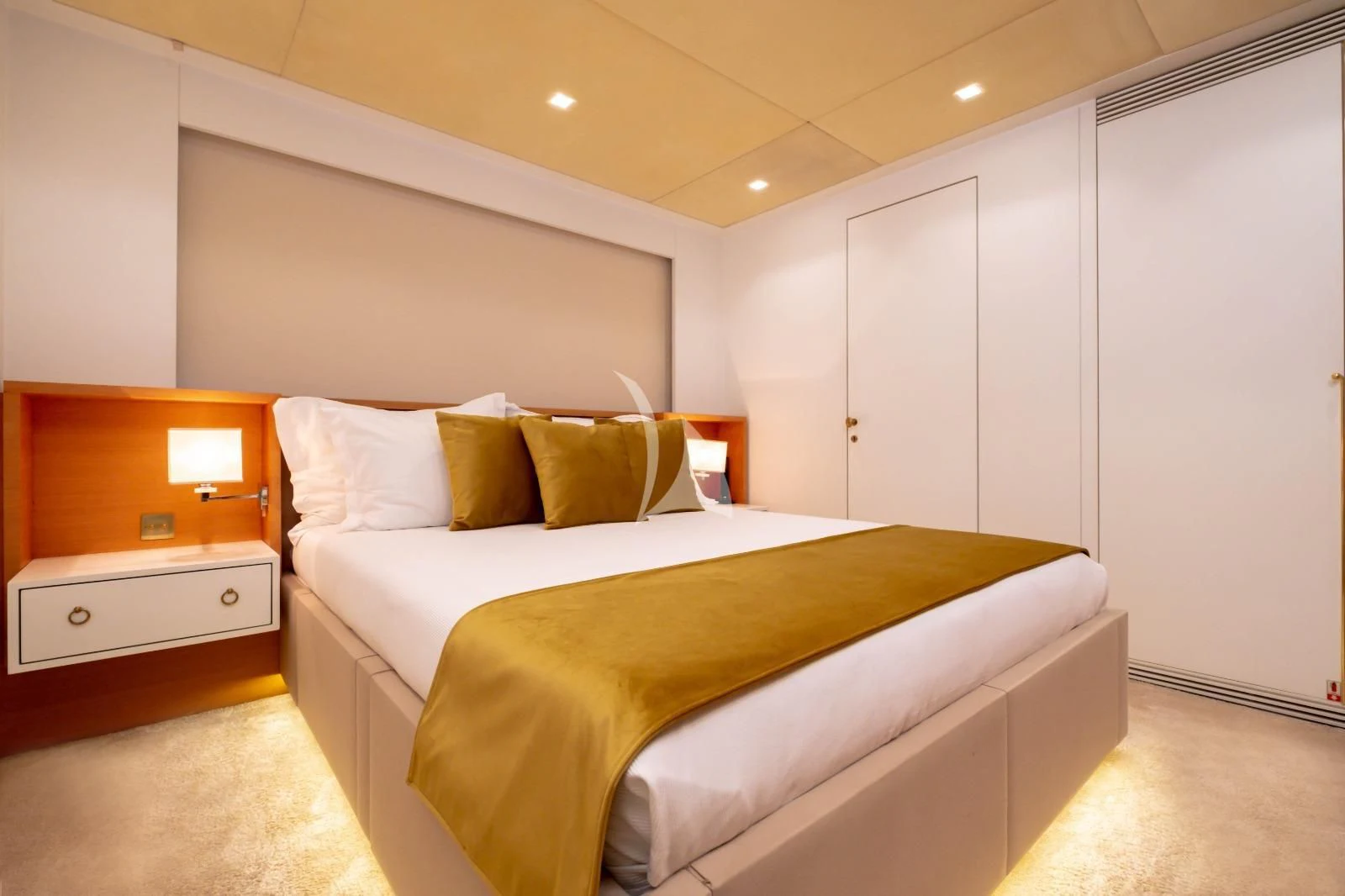 a room with a bed and a desk aboard HARUN Yacht for Charter