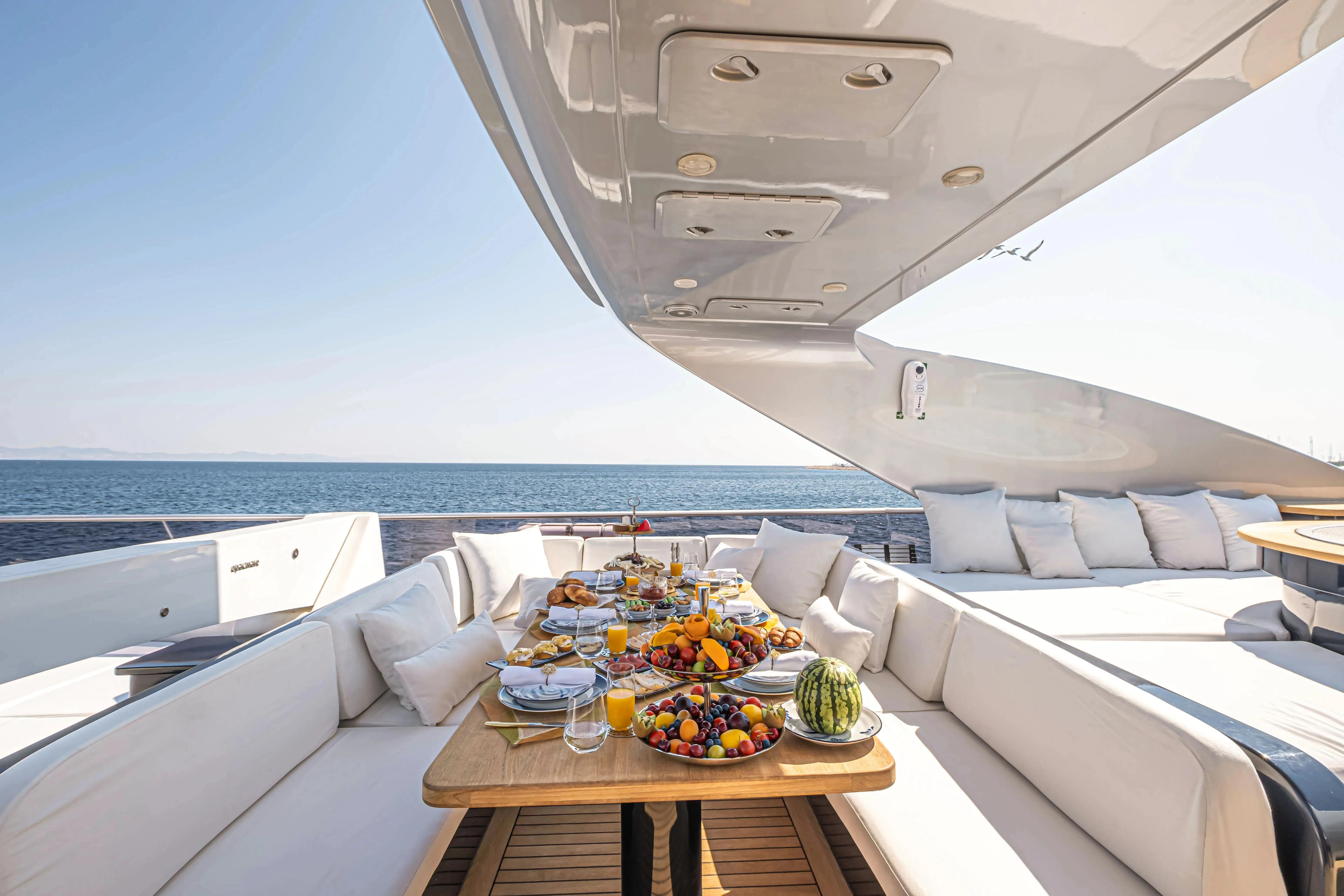 a room with a table and chairs aboard HARUN Yacht for Charter
