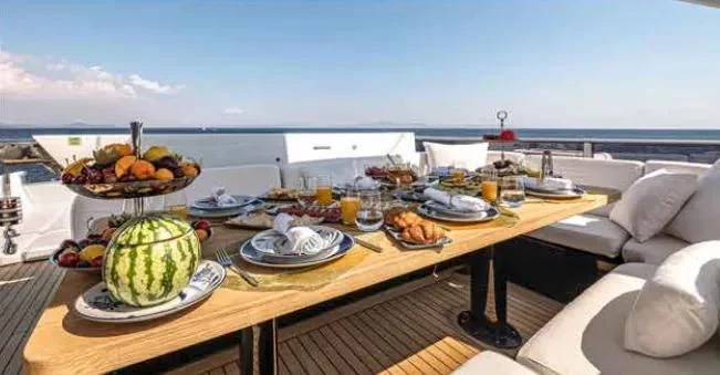 a table with food on it aboard HARUN Yacht for Charter