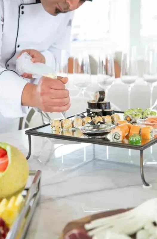 a doctor pouring a baby into a cup aboard HARUN Yacht for Charter