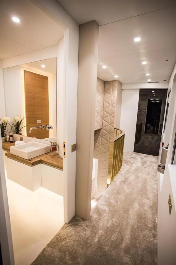 a bathroom with a marble floor aboard HARUN Yacht for Charter