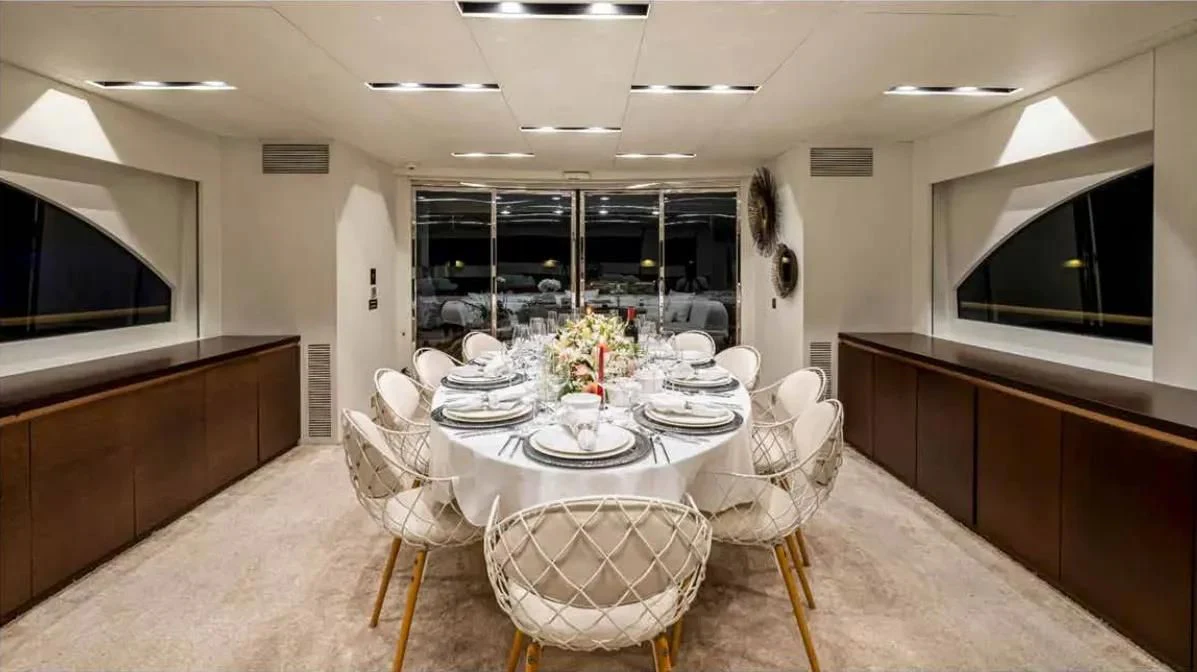 a large kitchen with a table and chairs aboard HARUN Yacht for Charter