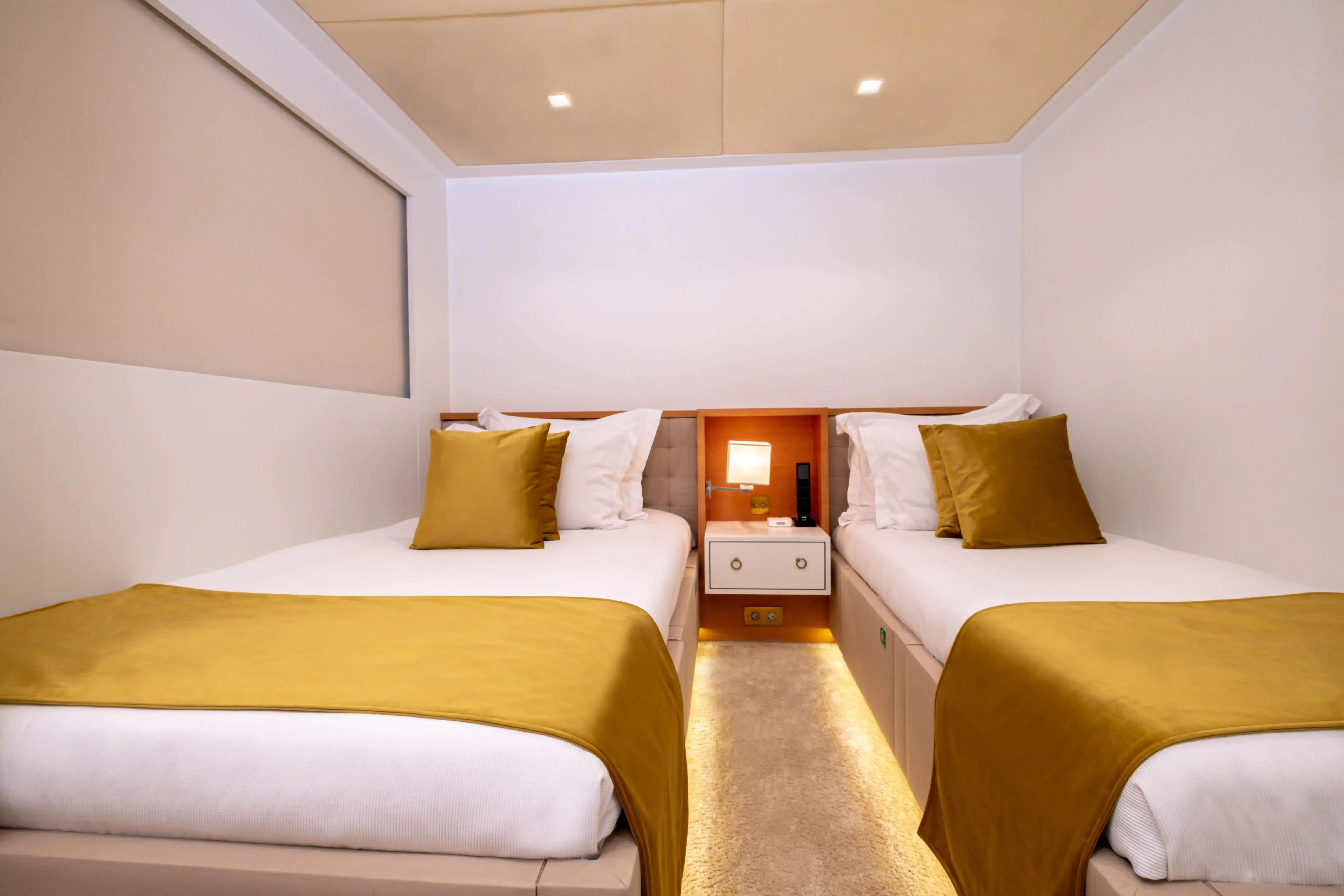 a room with two beds aboard HARUN Yacht for Charter