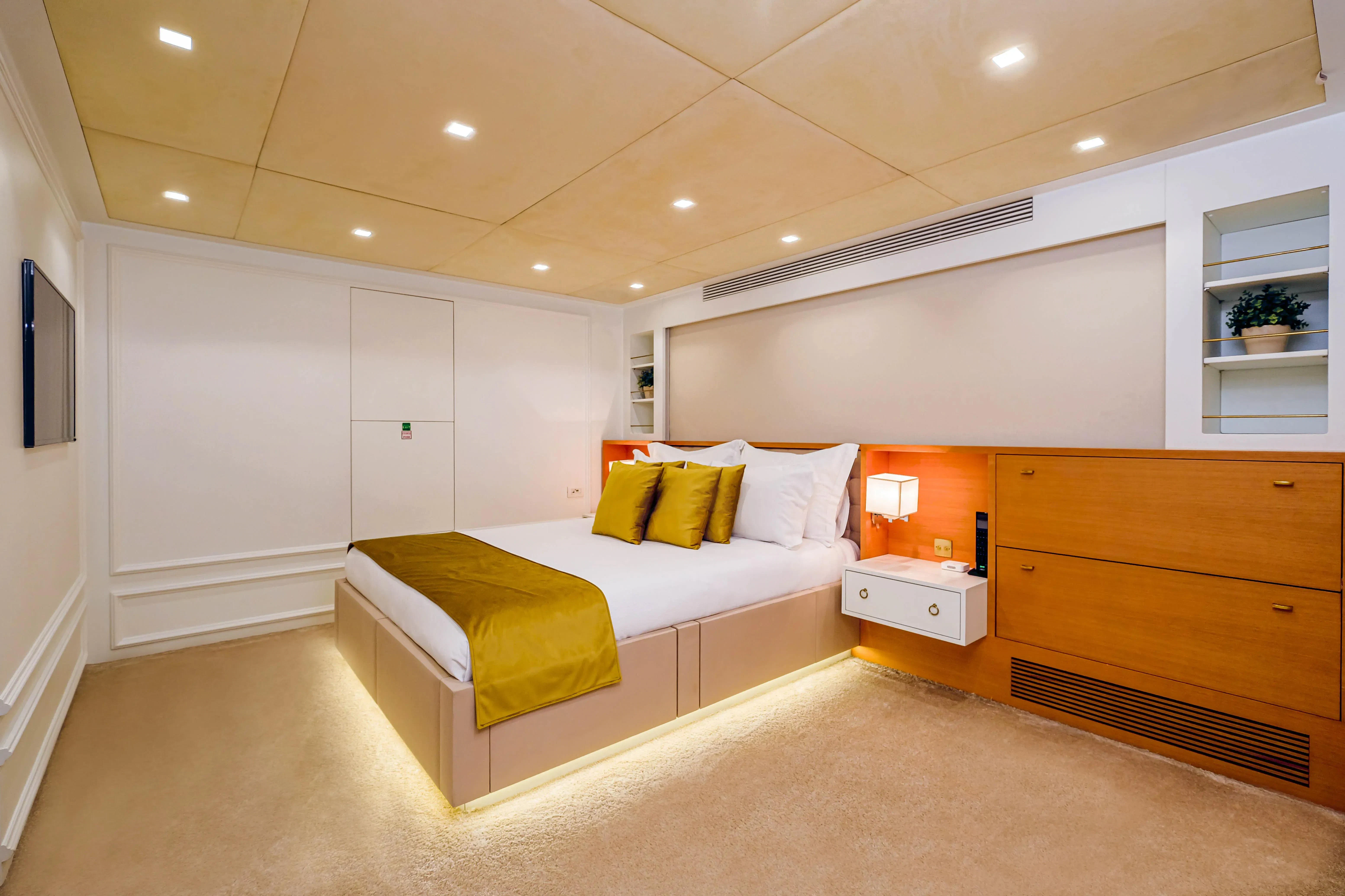 a bedroom with a bed and a desk aboard HARUN Yacht for Charter