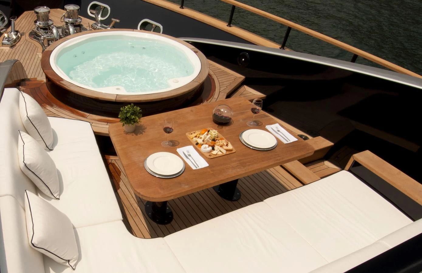 a table with plates and food on it aboard HARUN Yacht for Charter